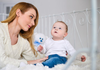 Portrait of happy mother and baby