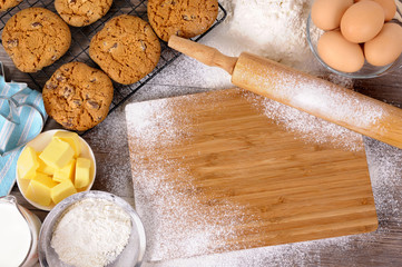 Baking cooking making biscuit cookies with ingredients chopping board and equipment background with space