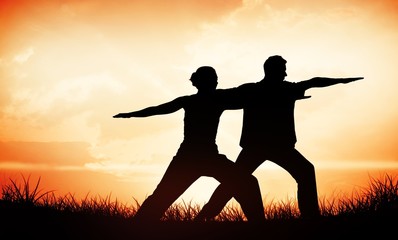 Peaceful couple in white doing yoga together