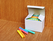Box Of Color Chalk On Wooden Background