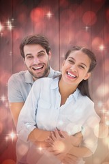 Poster - Composite image of cute couple hugging and smiling at camera