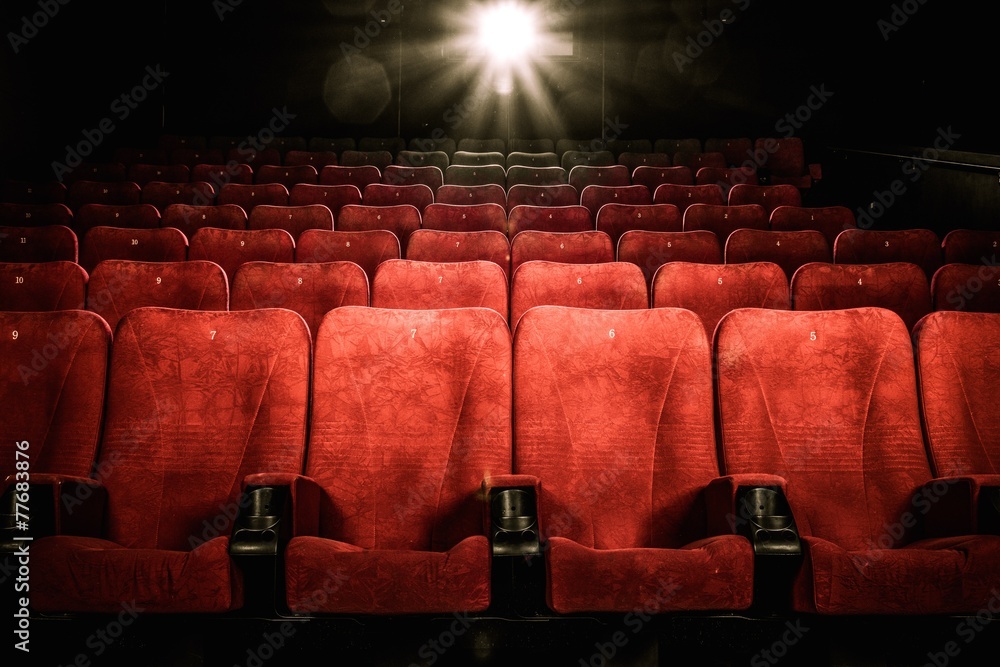 Empty comfortable red seats with numbers in cinema - obrazy, fototapety, plakaty 