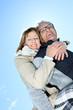 © Louis-Paul Photo - Portrait of happy senior couple in winter season