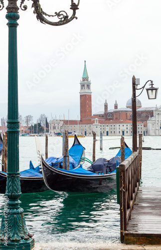 Fototapeta na wymiar Venetian gondolas with high tide.