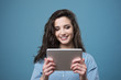 © StockPhotoPro - Beautiful smiling girl with tablet