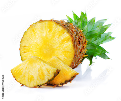 Fototapeta na wymiar Fresh pineapple fruits with cut and green leaves isolated on whi