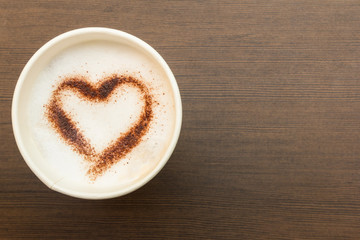 paper cup of coffee with heart symbol