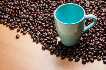 Wall Mural - Cup on coffee beans