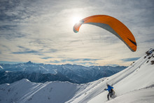 Paraglider Launching From Snowy Slope