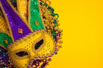 Mardi Gras Mask on yellow Background