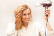 © ellemarien7 - Beautiful woman drying her hair with hairdryer