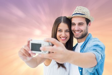 Poster - Composite image of happy hipster couple taking a selfie