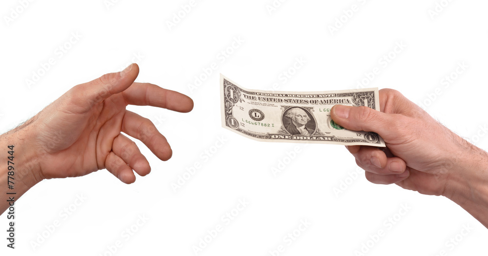Pagando dinero,mano sujetando billete de un dólar. Stock Photo | Adobe Stock