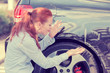 © pathdoc - Frustrated woman checking pointing at car scratches dents