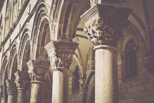 Fotografie, Obraz Gothic Stone Pillars in Retro Film Style