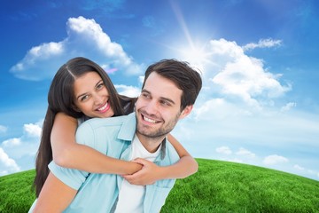 Poster - Happy casual man giving pretty girlfriend piggy back