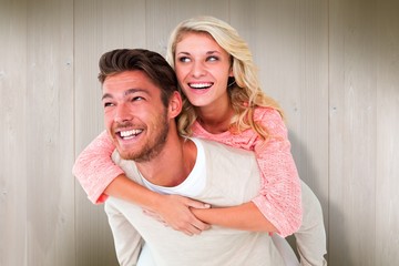 Poster - Handsome man giving piggy back to his girlfriend