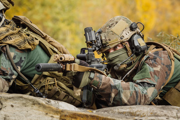 Wall Mural - marines with a rifle aiming at a target