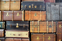 Background With Large Stack Of Antique Suitcases