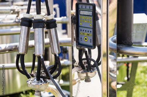 Fotografia, Obraz Automatic mechanized milking equipment for farm industry
