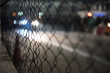 blur light bokeh and wire fence