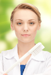 Poster - happy young female dentist with tooth brush