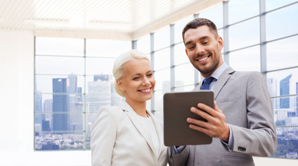 Canvas Print - smiling businessmen with tablet pc outdoors