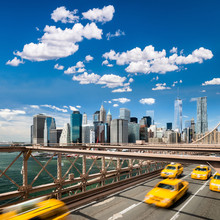 Group Of Typical Yellow New York Cabs On The Brooklyn Bridge