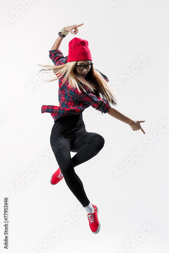 Fényképezés young beautiful dancer jumping on a studio background