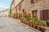 Fototapeta Uliczki - The old Italian town in the colors of spring in Tuscany 