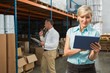 © WavebreakMediaMicro - Pretty warehouse manager using tablet pc