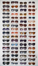 Assorted Styles Of Tinted Sunglasses On White Background