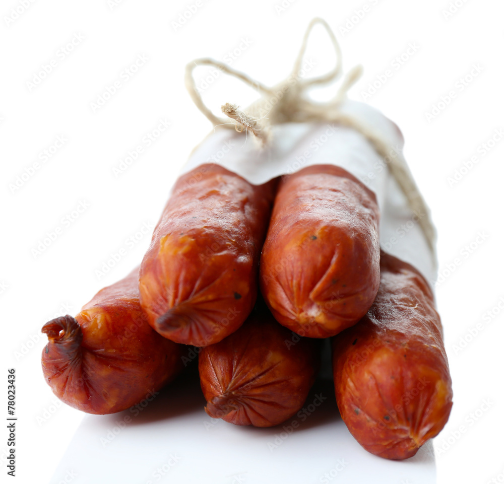 Smoked thin sausages, isolated on white