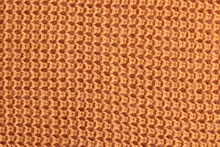 Texture Of A Orange Knitted Sweater
