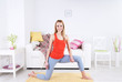 © Africa Studio - Young woman doing yoga at home