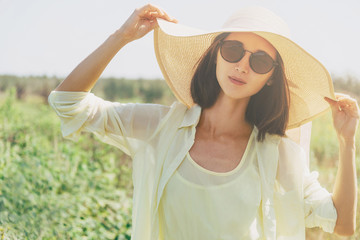 Poster - Beautiful woman resting in summer park