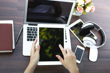 Wall Mural - Woman hand hold white tablet with blank empty screen