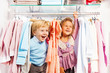 © Sergey Novikov - Excited boy and girl play hide-and-seek in store