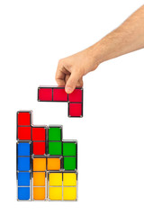 Wall Mural - Hand with tetris toy blocks