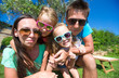 Closeup of beautiful family of four on tropical vacation