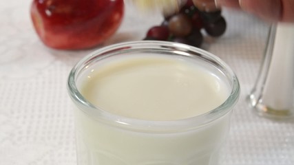 Sticker - Dunking a donut into a glass  of milk