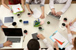 © Africa Studio - Group of business people working at desk top view
