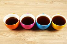 Cups Of Coffee On Wooden Table Background