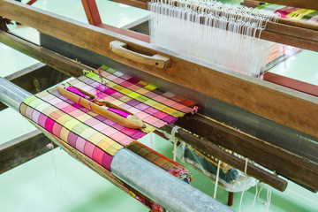 Loom for weaving silk in Thailand.