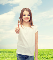 Wall Mural - girl in blank white t-shirt showing thumbs up