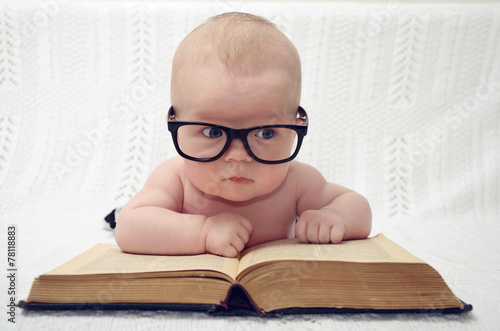 Fototapeta cute little baby in glasses