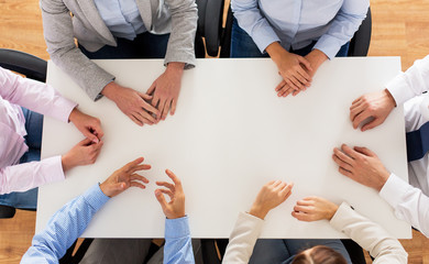 Canvas Print - close up of business team sitting at table