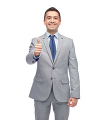 Poster - happy businessman in suit showing thumbs up