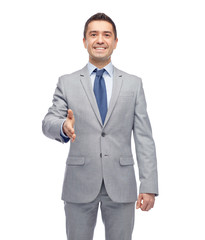 Poster - happy smiling businessman in suit shaking hand