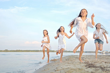 Wall Mural - Portrait of children on the beach in summer